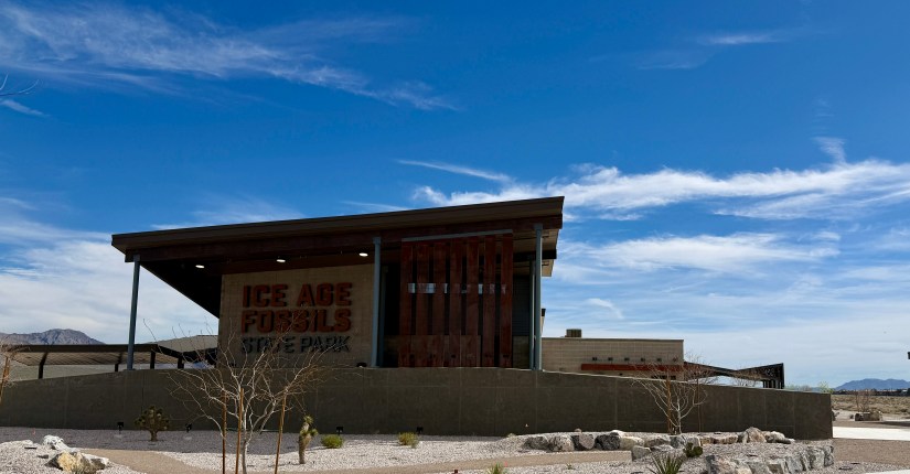 Exterior view of the Ice Age Fossils State Park building under a clear blue sky.
