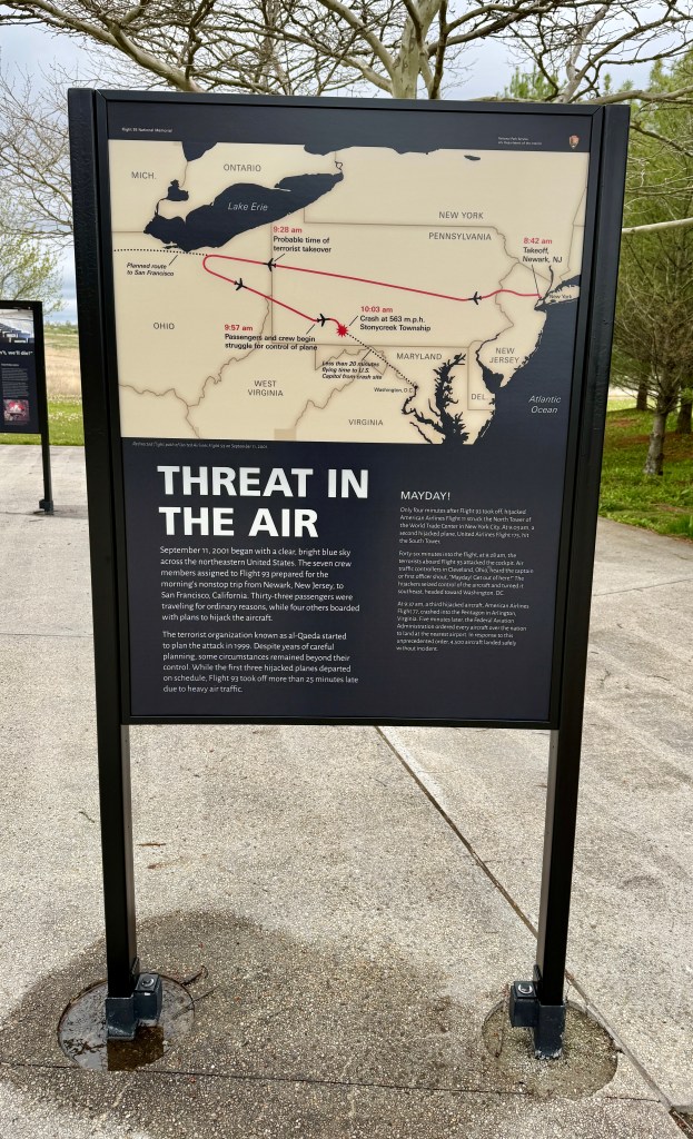 Informational sign detailing the events of September 11, 2001, including flight paths and timelines of the terrorist attacks in the northeastern United States.